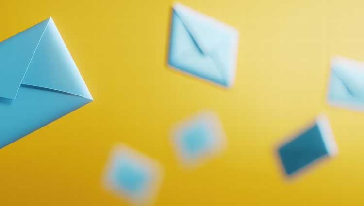 Image of flying envelopes - scattered against a yellow background.