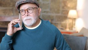 An image of an angry-looking elderly white man holding a cell phone to his ear, to illustrate a PlannedGiving.Com blog about fundraisers needing to be willing to take the tough calls.