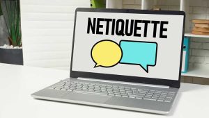 An image of a laptop displaying the word "netiquette" and two cartoon-like thought bubbles on screen, to illustrate a plannedgiving.com post on