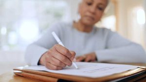 Older woman handwriting her will